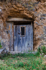 Old rustic vintage wood door closeup background. Ornamental gate detail texture pattern traditional ancient spanish design.