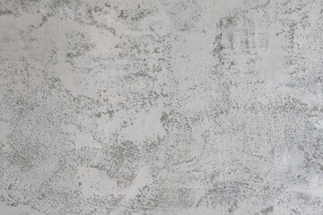 Cement or concrete wall with white painted color as loft decoration style. Interior design background texture photo.