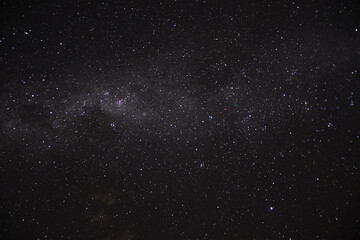 a long exposure of the dark sky with the stars
