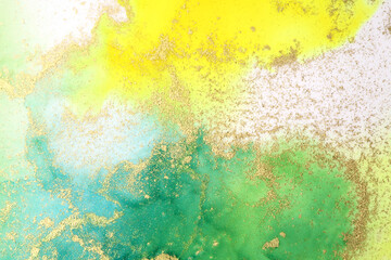 Kunst Abstrakte Malerei grün und gelb befleckt Aquarellhintergrund. Alkoholtintenfarben. Marmorstruktur.