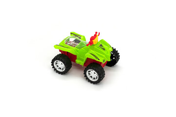 Plastic ATV toy isolated on white background.