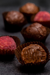 different chocolate pralines  vertical shot