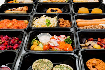 Healthy food and diet concept, restaurant dish delivery. Take away of fitness meal. Weight loss nutrition in foil boxes.