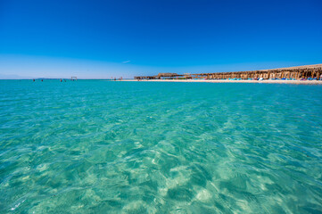 Fototapeta na wymiar Orange Bay with white beach and crystal clear azure water - paradise coastline of Giftun island, Mahmya, Hurghada, Red Sea, Egypt