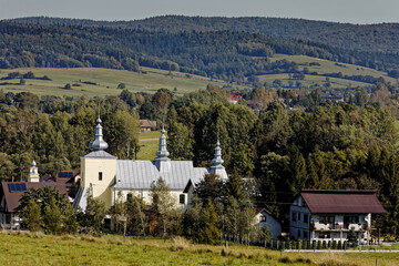 Former Greek-Catholic Lemko church building built in Smerekowiec village in 1818 year. Beskid Niski mountains landscape. - obrazy, fototapety, plakaty