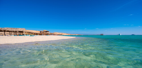 Orange Bay with white beach and crystal clear azure water - paradise coastline of Giftun island,...