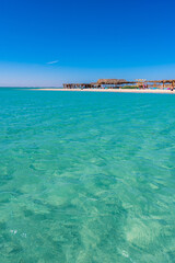 Fototapeta premium Orange Bay with white beach and crystal clear azure water - paradise coastline of Giftun island, Mahmya, Hurghada, Red Sea, Egypt