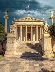 Athens Academy with Plato, Socrates, Athens and Apollo statues under impressive sky, Greece