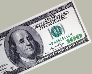 One hundred american dollars close up on a gray background