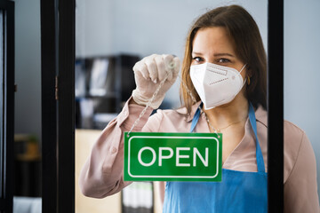Restaurant Or Cafe Owner With Open Sign