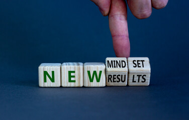 New mindset and results symbol. Businessman turns wooden cubes and changes words 'new mindset' to 'new results'. Beautiful grey background. Business, new mindset and results concept. Copy space.