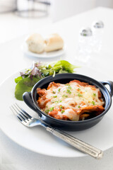 Dish of Lasagna and Side Salad