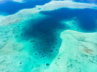 Aerial: exotic tropical island white sand beach away from it all, coral reef caribbean sea...
