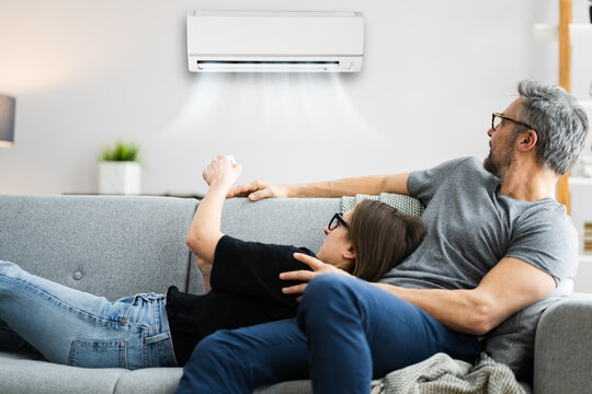 Happy Family Using Air Condition