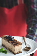 Unrecognizable woman hands with plate of French pastries