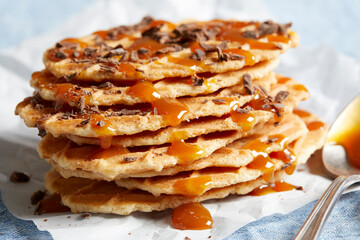Waffle crisps with dark chocolate and caramel sauce