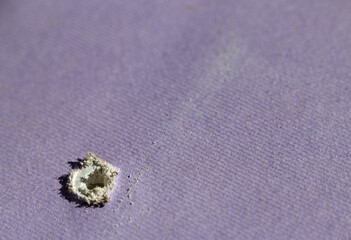 Hole in drywall left by screw or nail