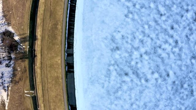 Aerial winter view of the huge dam in Latvia near city of Salaspils and Riga.