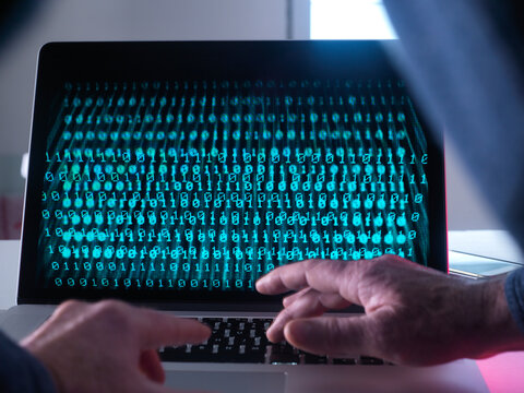 Cyber Crime, laptop computer being hacked
