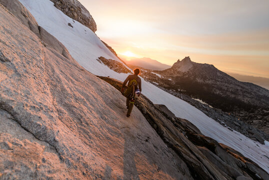 Climber enjoying view on peak, Tuolumne Meadows, Yosemite National Park, California, United States