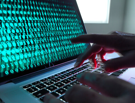 Cyber Crime, laptop computer being hacked