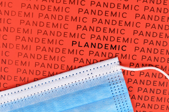 Word 'Plandemic' Between Lines Wird Word 'Pandemic' With Medical Face Mask. Concept For Conspiracy Theories During Corona Virus Crisis