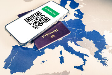 Digital green passport with QR code on a smartphone over an EU map.The European Union will propose issuing a certificate called a Digital Green Pass