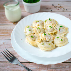 Dumplings pielmieni - a traditional dish of Russian cuisine.