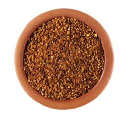 Pollen pile in clay pot isolated on white background, top view