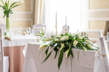 Beautiful decoration of the wedding holiday with flowers and greenery with florist decoration