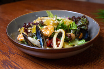 Mix of salad with seafood, shrimps and squid rings. Healthy food