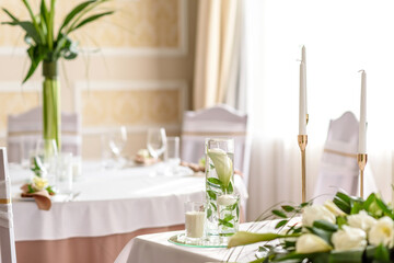 Beautiful decoration of the wedding holiday with flowers and greenery with florist decoration