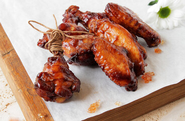 fried barbecue chicken wings marinated in spices with hot pepper and lemon.