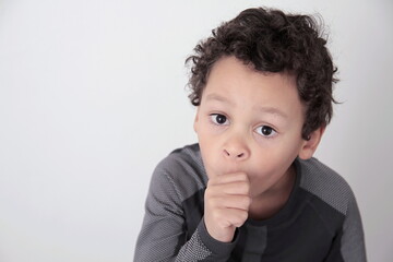 little boy sucking his thumb stock photo