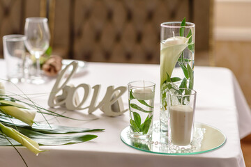 Beautiful decoration of the wedding holiday with flowers and greenery with florist decoration