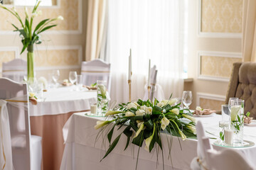 Beautiful decoration of the wedding holiday with flowers and greenery with florist decoration