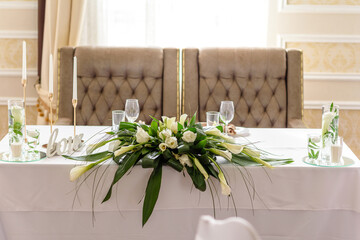 Beautiful decoration of the wedding holiday with flowers and greenery with florist decoration