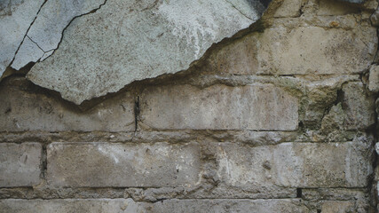 Obraz na płótnie Canvas Textura de pared de ladrillos y cemento desgastada