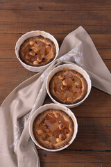 Homemade baking. Shortcrust tartlets stuffed with apples and hazelnuts