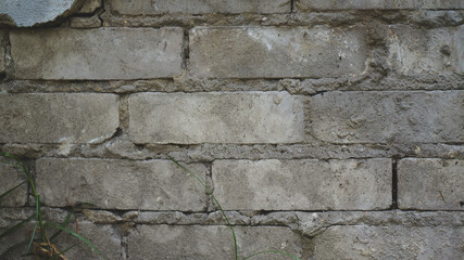 Textura de pared de ladrillos y cemento desgastada