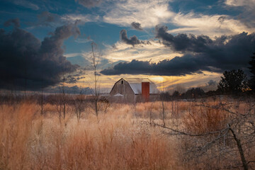 Old abandoned Rustic Barn with Sunrise