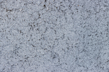 Abstract close up of melting snow in the spring which has created ice crystals that sparkle in the sunshine