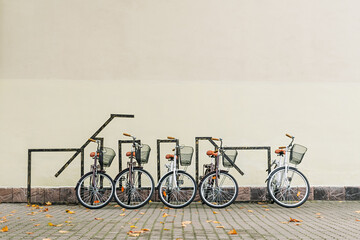 Bicycles on the background of a light wall.