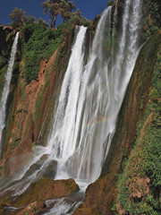 Ouzoud Waterfall in Morocco is an enclave of green and cooling water, popular spot for natives and...