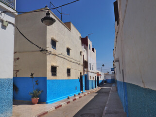 Mediterranean style white and blue moody streets. Old town in Rabat, the capital city of Morocco with characteristic white and blue walls paintings in narrow streets. 