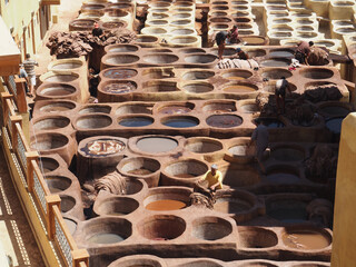 Tannery in Fez with tanner round tanks. Traditional tannery tanks in Fez city, view from above