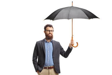 Bearded man standing and holding an open umbrella