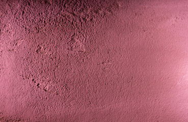 Pink plastered wall. Close up of the pink plastered wall texture surface. Old plastered house wall