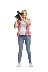 Full length portrait of a young casual woman recording with a camera