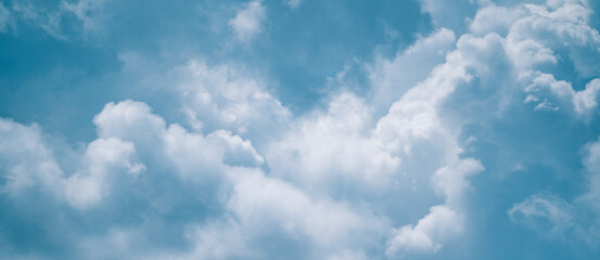 Abstract background of clouds sky with white voluminous foamy air magic clouds in a blue sky. Calm, relax, paradise, heaven, inspiration.